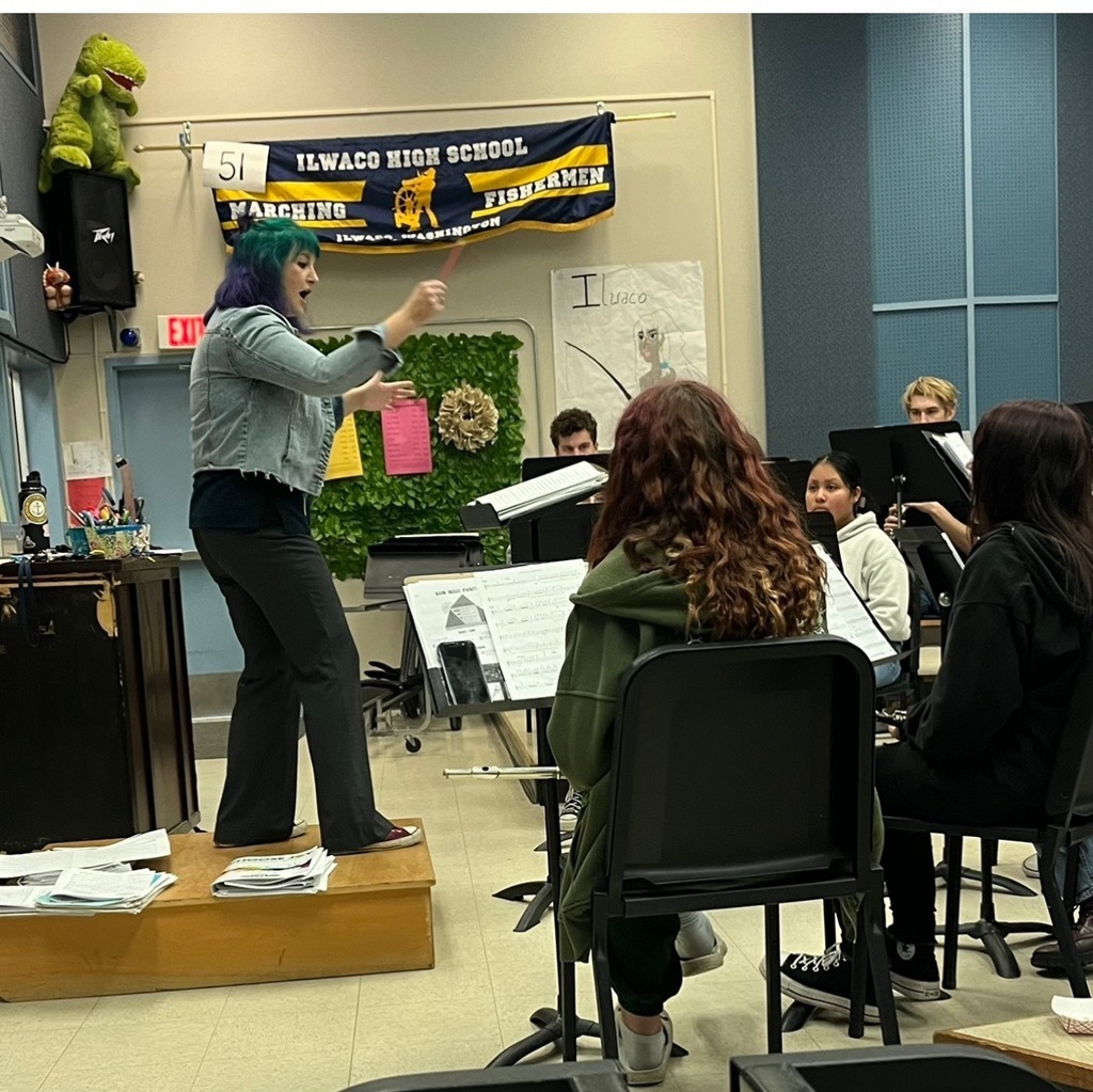 Music teacher Rachael Lake conducting a group of musicians at the Ilwaco High School.
